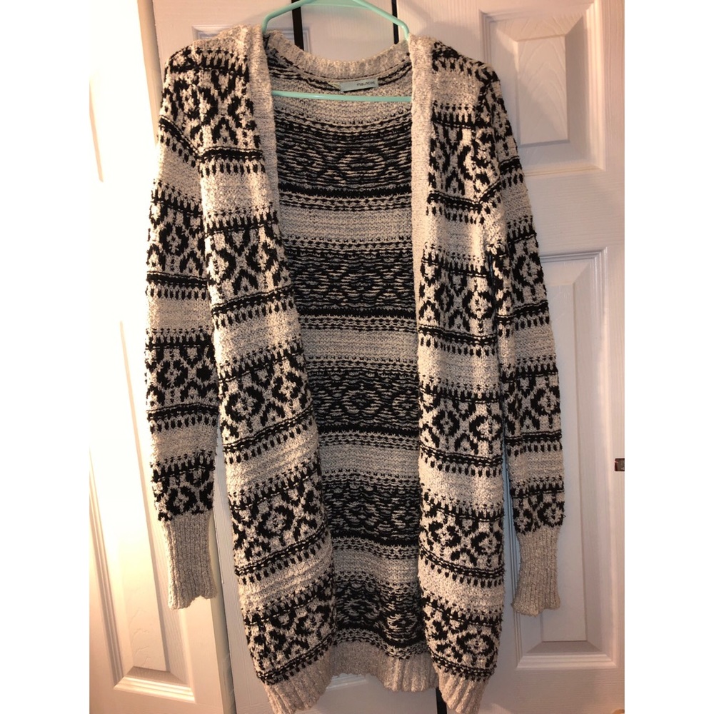 Maurice’s thick cardigan
